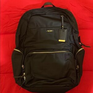 Tumi Black and Gold Backpack